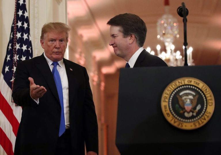 President Donald Trump gestures with Judge Brett Kavanaugh his Supreme Court nominee, in the East Room of the White House, Monday, July 9, 2018, in Washington.
