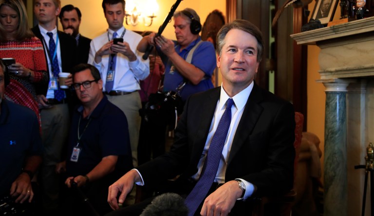 FILE - In this July 11, 2018, photo, Supreme Court nominee Brett Kavanaugh listens to Sen. Rob Portman, R-Ohio, on Capitol Hill in Washington, during a meeting. The White House is turning up the pressure on Senate Democrats to meet with President Donald Trumpâs Supreme Court nominee, though with little success.