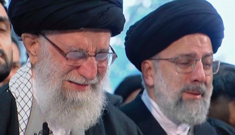 In this image taken from video, Iranian Supreme Leader Ayatollah Ali Khamenei, left, openly weeps as he leads a prayer over the coffin of Gen. Qassem Soleimani, who was killed in Iraq in a U.S. drone strike on Friday, at the Tehran University campus, in Tehran, Iran, Monday, Jan. 6, 2020.