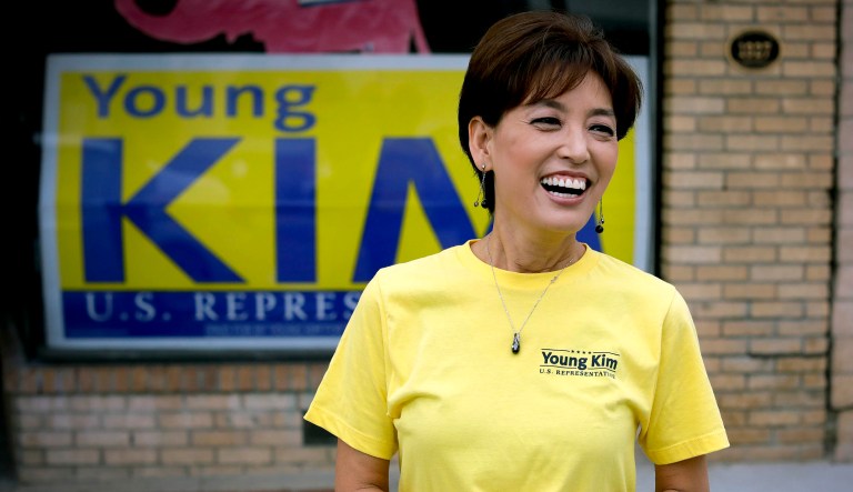 In this Saturday, Oct. 6, 2018, photo, Young Kim, a candidate who is running for a U.S. House seat in the 39th District in California, smiles outside her campaign office in Yorba Linda, Calif.