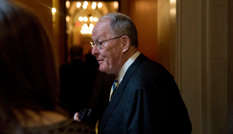 Sen. Lamar Alexander, R-Tenn., arrives as Republican senators gather to meet with Senate Majority Leader Mitch McConnell, R-Ky., on the GOP effort to overhaul the tax code, on Capitol Hill, Friday, Dec. 1, 2017, in Washington.
