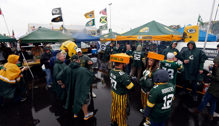 Fans tailgate outside Lambeau Field before an NFL football game between the Green Bay Packers and the New Orleans Saints, Sunday, Oct. 22, 2017, in Green Bay, Wis.
