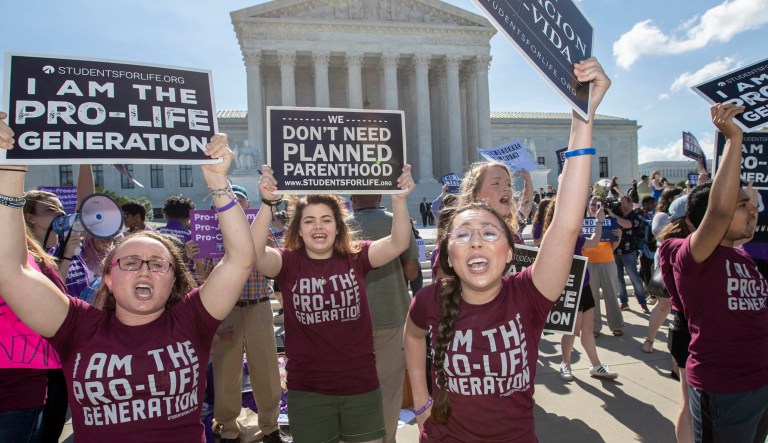 Pro-life and anti-abortion advocates demonstrate in front of the Supreme Court early Monday, June 25, 2018.