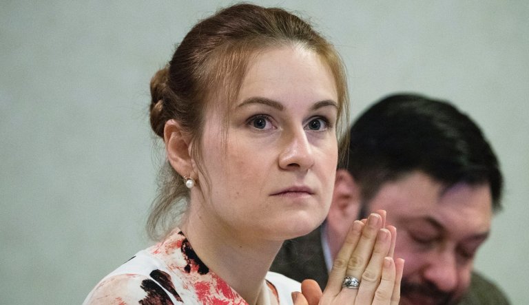 A journalist presents a bunch of flowers to Russian agent Maria Butina, upon her arrival from the United States at Moscow International Airport Sheremetyevo outside Moscow, Russia, Saturday, Oct. 26, 2019. Butina, a gun rights activist who sought to infiltrate conservative U.S. political groups and promote Russia's agenda around the time that Donald Trump rose to power, was released Friday from a low-security facility in Florida. 