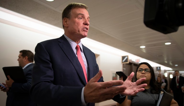 Sen. Mark Warner, D-Va., vice-chair of the Senate Intelligence Committee, takes questions from reporters on Capitol Hill in Washington, Tuesday, Aug. 21, 2018.