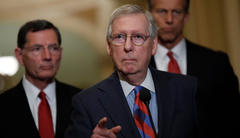 Senate Majority Leader Mitch McConnell, a Republican from Kentucky, center, speaks during a news conference after a Senate Republican weekly luncheon meeting at the U.S. Capitol in Washington, D.C., U.S., on Tuesday, May 15, 2018. McConnell says he is "somewhat optimistic" after conversations with Senate Democratic leader Chuck Schumer that there will be more cooperation on nominations and appropriations.