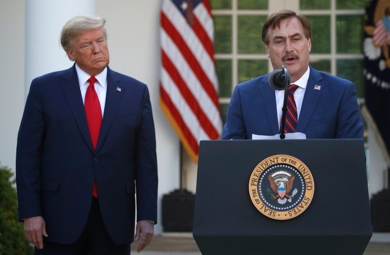 My Pillow CEO Mike Lindell speaks as President Donald Trump listens during a briefing about the coronavirus in the Rose Garden of the White House, Monday, March 30, 2020, in Washington.