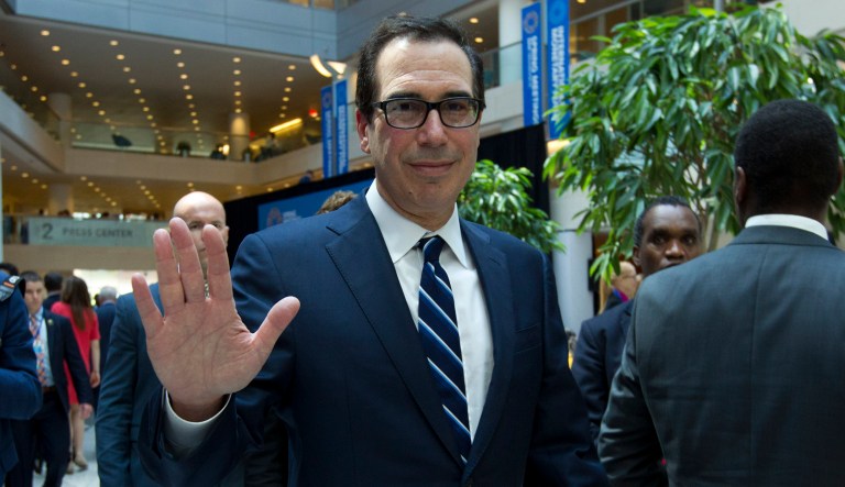 Treasury Secretary Steven Mnuchin waves after attending the International Monetary and Financial Committee conference at the World Bank/IMF Spring Meetings in Washington, Saturday, April 13, 2019.