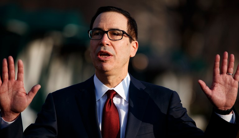 Treasury Secretary Steve Mnuchin speaks with reporters outside the White House, Wednesday, Feb. 6, 2019, in Washington.