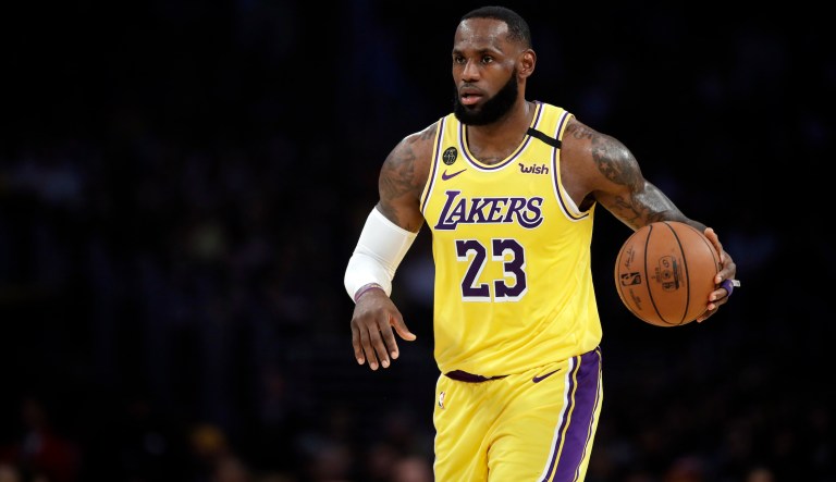 Los Angeles Lakers' LeBron James (23) dribbles during the first half of an NBA basketball game against the Brooklyn Nets Tuesday, March 10, 2020, in Los Angeles.