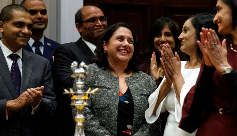 Neomi Rao, Administrator of the Office of Information and Regulatory Affairs, smiles as President Donald Trump announces his intention to nominate her to fill Brett Kavanaugh's seat on the U.S. Court of Appeals for the D.C. Circuit, during a Diwali ceremonial lighting of the Diya in the Roosevelt Room of the White House, Tuesday, Nov. 13, 2018, in Washington.