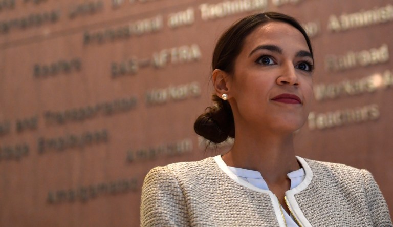 Rep.-elect Alexandria Ocasio-Cortez, D-N.Y., listens during a news conference with members of the Progressive Caucus in Washington, Monday, Nov. 12, 2018.
