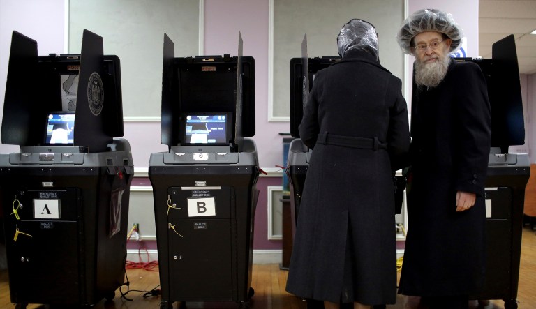 An elderly orthodox jewish couple cast their votes at a local polling center on Tuesday, Nov. 6, 2018, in Brooklyn borough of New York.