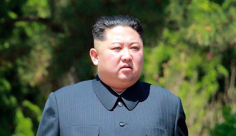 In this Tuesday, May 8, 2018, photo provided by the North Korean government, North Korean leader Kim Jong Un, left, and Chinese President Xi Jinping talk while walking in Dalian, China. Independent journalists were not given access to cover the event depicted in this image distributed by the North Korean government. The content of this image is as provided and cannot be independently verified. Korean language watermark on image as provided by source reads: "KCNA" which is the abbreviation for Korean Central News Agency.