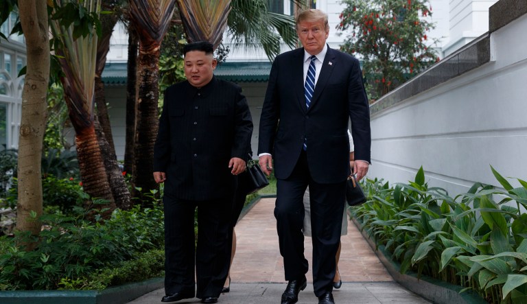 President Donald Trump and North Korean leader Kim Jong Un take a walk after their first meeting at the Sofitel Legend Metropole Hanoi hotel, Thursday, Feb. 28, 2019, in Hanoi.