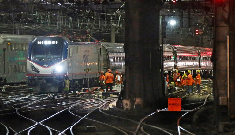 FILE - In this July 9, 2017 file photo, Amtrak workers continue ongoing infrastructure renewal work beneath Penn Station in New York. Proponents of a $13 billion project to build a new rail tunnel between New York and New Jersey seen as critical for the future of the nation's busiest rail corridor are panning President Donald Trump's infrastructure proposal. The budget released by the White House on Monday, Feb. 12, 2018, envisions $1.5 trillion in infrastructure spending over the next 10 years; however, only $200 billion would be direct federal spending aimed at leveraging state and local dollars.