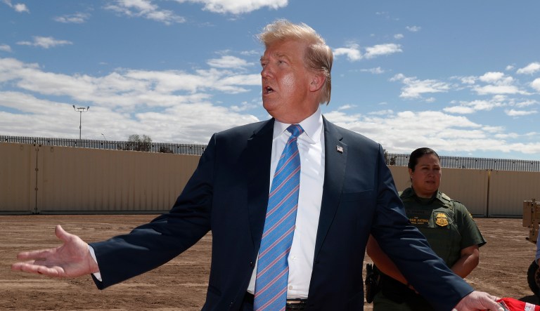 President Donald Trump visits a new section of the border wall with Mexico in Calexico, Calif., Friday April 5, 2019.