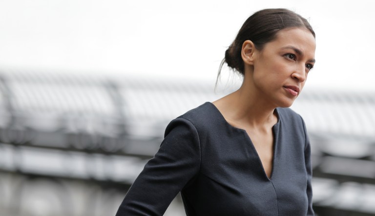 Alexandria Ocasio-Cortez talks to a reporter in New York, Wednesday, June 27, 2018. The 28-year-old political newcomer who upset U.S. Rep. Joe Crowley in New York's Democrat primary says she brings an "urgency" to the fight for working families.