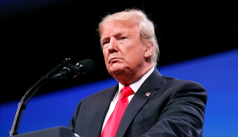 President Donald Trump pauses while speaking at the International Association of Chiefs of Police annual conference, Monday, Oct. 8, 2018, in Orlando, Fla.