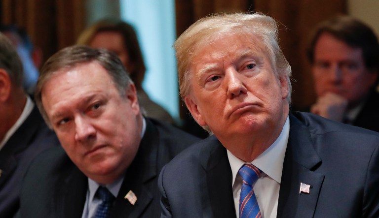 President Donald Trump, right, and Secretary of State Mike Pompeo, left, listen to Ivanka Trump, the daughter and assistant to President, speaks during his meeting with members of his cabinet in Cabinet Room of the White House in Washington, Wednesday, July 18, 2018.