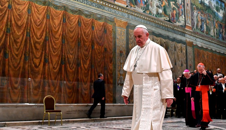 Pope Francis walks after posing for photographs with members of the Diplomatic Corps accredited to the Holy See, inside the Sistine Chapel inside the Sistine Chapel, at the Vatican, Monday, Jan. 7, 2019.