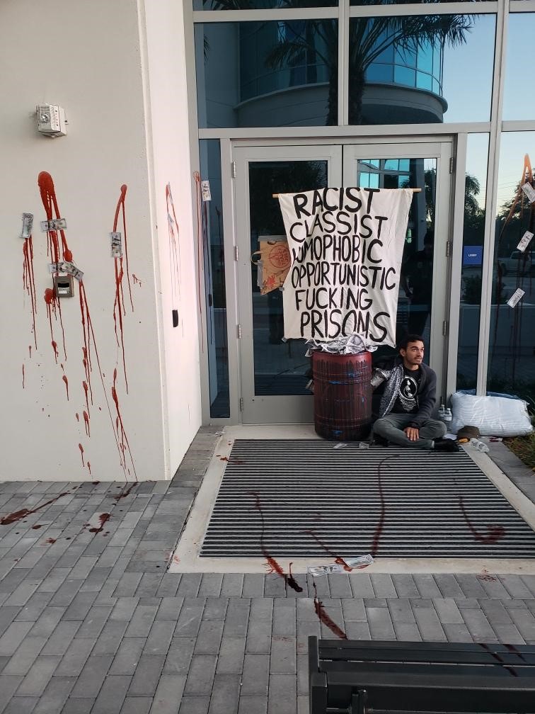 Protesters hold flowers as tear gas fired by police rises at a demonstration in front of Amir Kabir University in Tehran.
