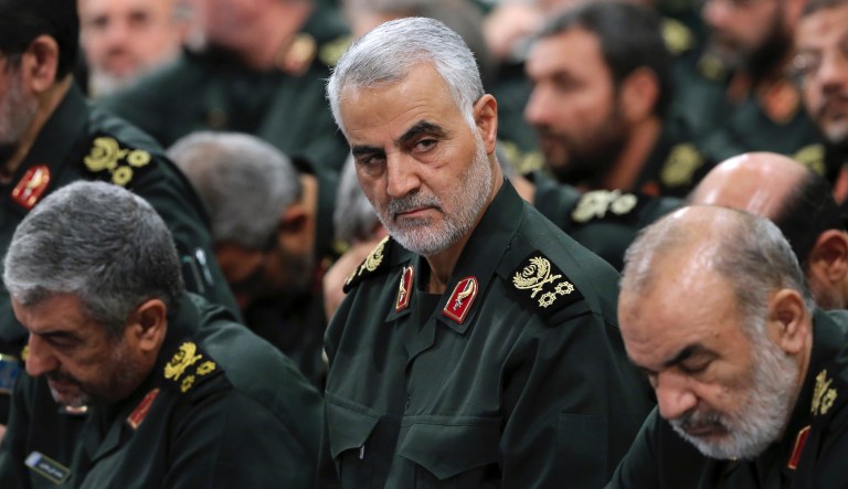 In this Sept. 18, 2016, file photo provided by an official website of the office of the Iranian supreme leader, Revolutionary Guard Gen. Qassem Soleimani, center, attends a meeting in Tehran, Iran.