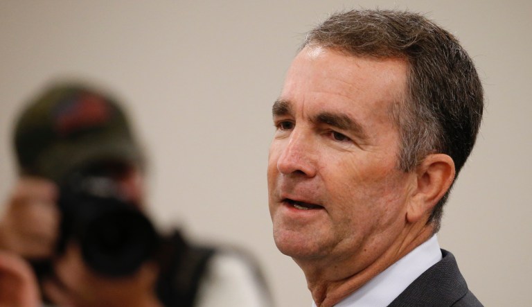 In this Aug. 20, 2019, file photo, Virginia Gov. Ralph Northam  delivers his budget update before a joint meeting of the House and Senate money committees at the Capitol in Richmond, Va.