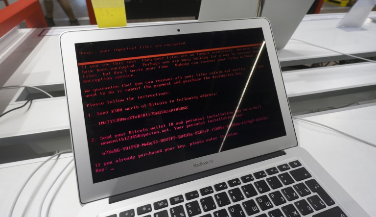 A ransomware demand for the payment of $300 worth of bitcoin sits on the screen of an Apple Inc. Macbook Air laptop infected by the 'Petya' computer virus inside an electronics store in Kiev, Ukraine, on Wednesday, June 28, 2017. 