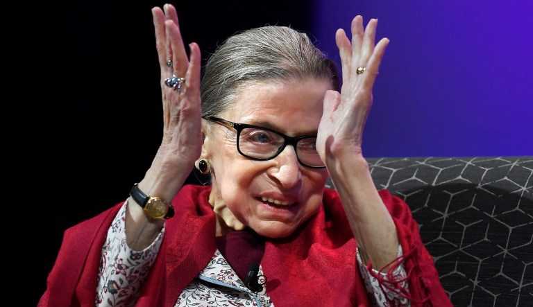 In this Oct. 3, 2019 photo, U.S. Supreme Court Justice Ruth Bader Ginsburg claps after listening to students sing opera at Amherst College in Amherst, Mass.  Supreme Court Justice Ruth Bader Ginsburg is the winner of this year's $1 million Berggruen Prize for philosophy and culture.  The award announced Wednesday by the Los Angeles-based Berggruen Institute honors Ginsburg for her pioneering legal work for gender equality and her support for the rule of law. The institute says Ginsburg will direct the money to charity.