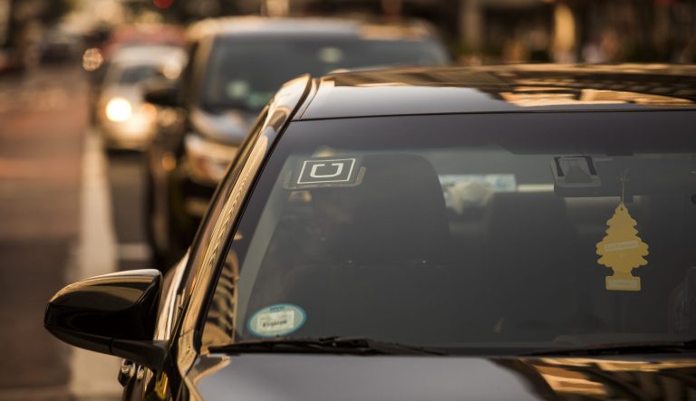 The Uber logo is seen on the windshield of a vehicle in New York on Thursday, Aug. 9, 2018.