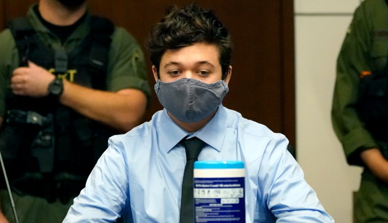 Kyle Rittenhouse sits while listening during an extradition hearing in Lake County court Friday, Oct. 30, 2020, in Waukegan, Ill. Rittenhouse is accused of killing two protesters days after Jacob Blake was shot by police in Kenosha, Wis.
