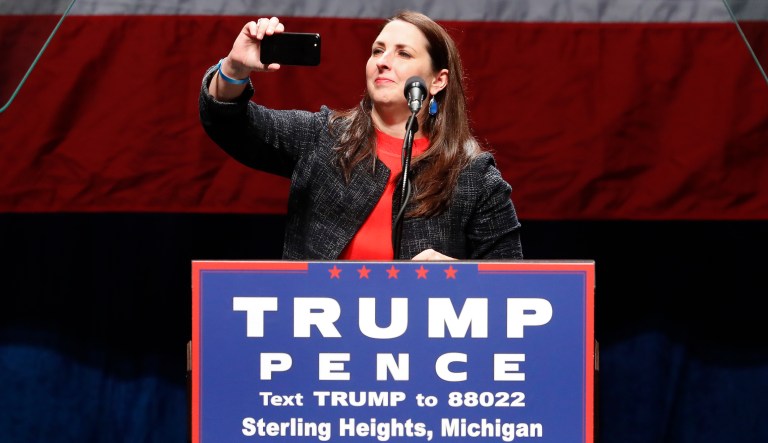 Ronna Romney McDaniels, Chairman of the Michigan Republican Party, takes a photo of the audience at a campaign rally for Republican presidential candidate Donald Trump in Sterling Heights, Mich., Sunday, Nov. 6, 2016.