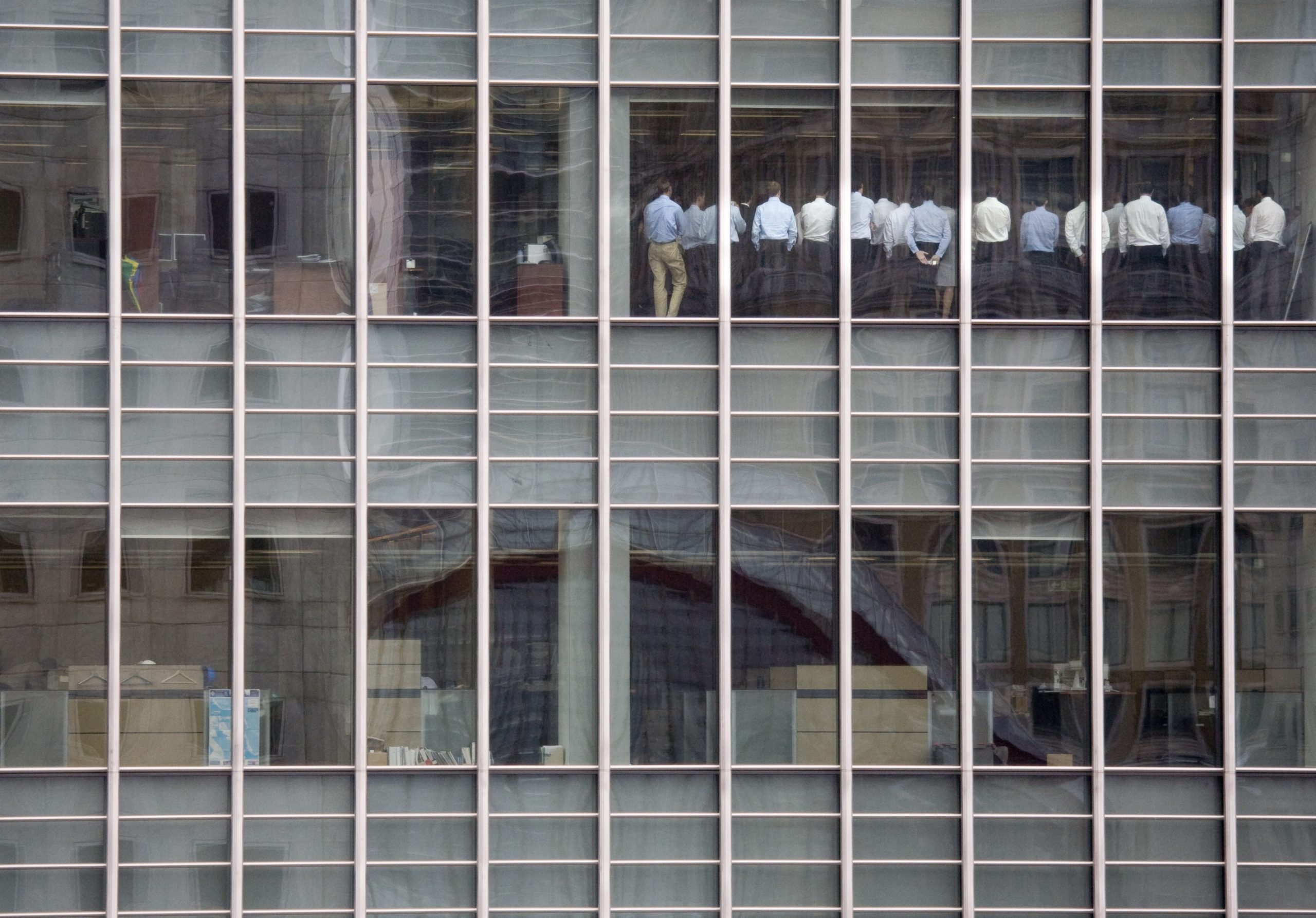 Lehman Brothers staffers seen through the window of their London offices in September 2008