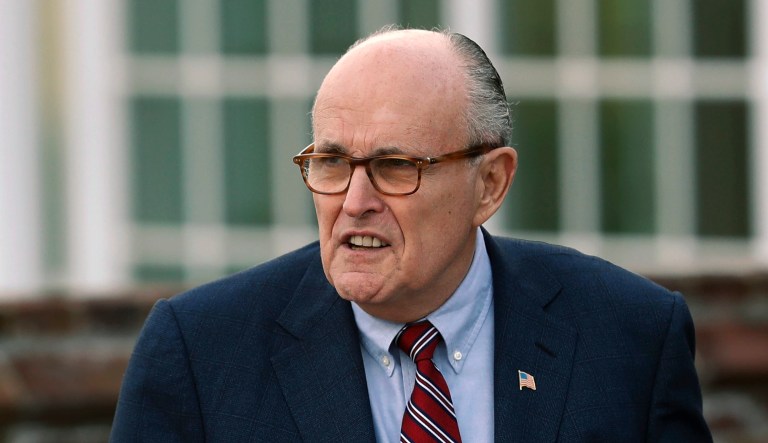 FILE - In this Nov. 20, 2016 file photo, former New York Mayor Rudy Giuliani arrives at the Trump National Golf Club Bedminster clubhouse in Bedminster, N.J. President Donald Trump's new lawyer Rudy Giuliani said Wednesday, May 2, 2018, the president repaid attorney Michael Cohen for a $130,000 payment to porn star Stormy Daniels. Giuliani made the revelation during an appearance on Fox News Channel's "Hannity."