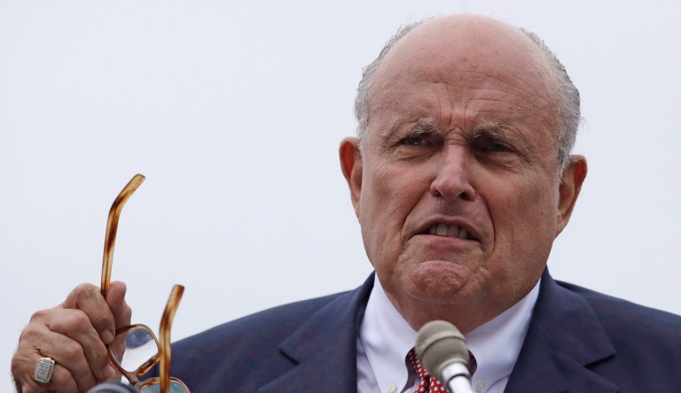 In this Aug. 1, 2018 file photo, Rudy Giuliani, an attorney for President Donald Trump, addresses a gathering during a campaign event for Eddie Edwards, who is running for the U.S. Congress, in Portsmouth, N.H.