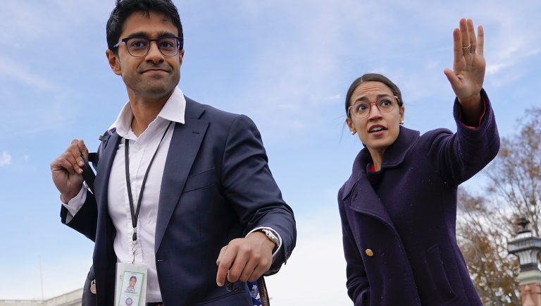 Rep.-elect Alexandria Ocasio-Cortez, D-NY., right, and her chief of staff Saikat Chakrabarti, left, walk back together after joining other members of the freshman class of Congress for a group photo on Capitol Hill in Washington, Wednesday, Nov. 14, 2018. 