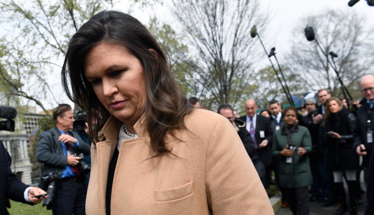 White House press secretary Sarah Sanders turns to go back into the White House in Washington after speaking to reporters, Tuesday, April 2, 2019.