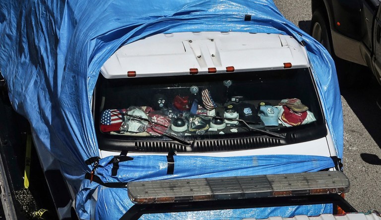The van that federal agents are investigating in connection with package bombs that were sent to high-profile critics of President Donald Trump is transported on a flatbed tow truck on Friday, Oct. 26, 2018 in Miramar, Fla.  Federal authorities took Cesar Sayoc into custody Friday in connection with the mail-bomb scare that earlier widened to 12 suspicious packages sent to prominent Democrats from coast to coast. 