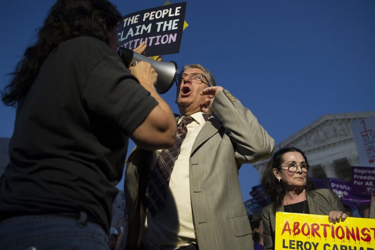 Pro-choice and anti-abortion protesters demonstrate in front of the U.S. Supreme Court, July 9, 2018. President Trump  announced his Supreme Court nominee Judge Brett Kavanaugh monday night.