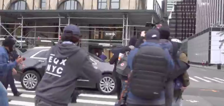 ‘F— you, Rudy’: Protesters throw eggs at Giuliani while he drives through Manhattan