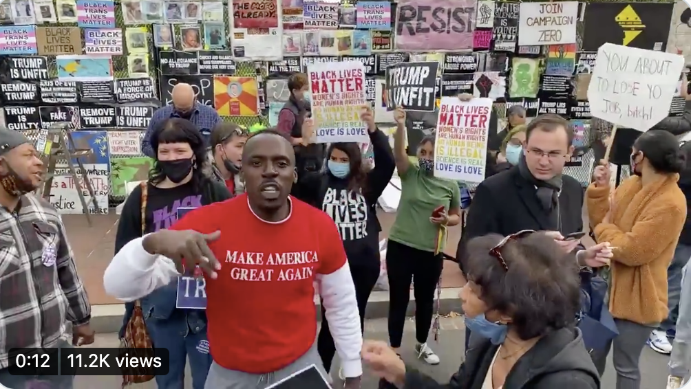Man in MAGA shirt flaunts Trump support in front of protesters at Black Lives Matter Plaza on Election Day