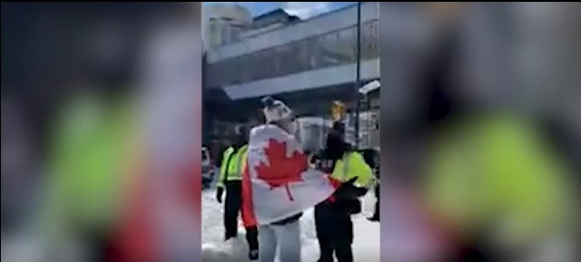 Screenshot of video featuring protesters and police in Ottawa