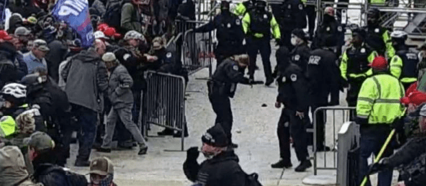 Screenshot from the Justice Department's criminal complaint against Julian Khater and George Tanios for an alleged chemical spray assault against law enforcement, including Capitol Police Officer Brian Sicknick, on January 6, 2021.