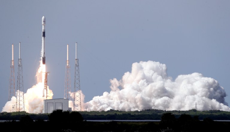 SpaceX chief engineer Elon Musk, second from left, talks to the media with NASA Administrator Jim Bridenstine, left, and NASA astronauts crew Doug Hurley and Bob Behnken, right, in front of the Crew Dragon spacecraft, about the progress to fly astronauts to and from the International Space Station, from American soil, as part of the agencyâs commercial crew program at SpaceX headquarters, in Hawthorne, Calif., Thursday, Oct. 10, 2019.