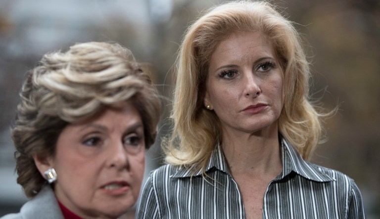 Summer Zervos, right, an attorney Gloria Allred speak to reporters outside Manhattan State Supreme court, Tuesday, Dec. 5, 2017, in New York. Zervos, a contestant on the reality TV show "The Apprentice" in 2006 who accused President Donald Trump of unwanted sexual contact in 2007, filed a defamation lawsuit  after he dismissed her claims as "fabricated and made-up charges."