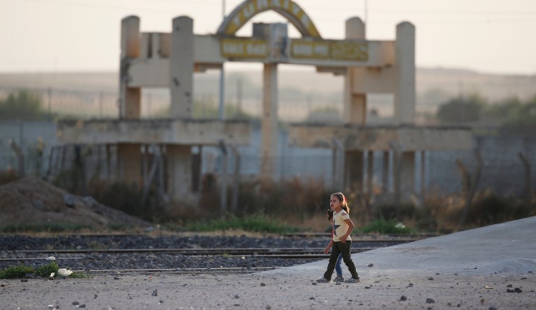 Children play at the border between Turkey and Syria, in Akcakale, Sanliurfa province, southeastern Turkey.                          
