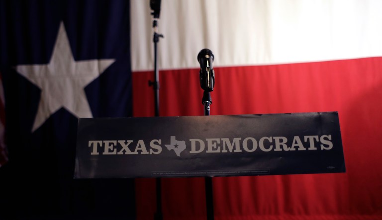 A Texas Democrats sign hangs on a podium at a Democratic watch party following the Texas primary election, Tuesday, March 6, 2018, in Austin, Texas. 