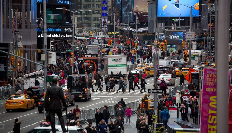 Pedestrians walk through the Times Square neighborhood of New York, U.S., on Monday, Dec. 17, 2018.