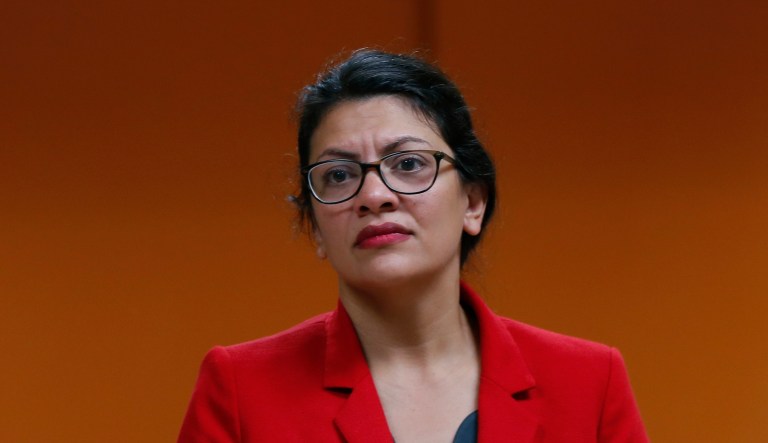 U.S. Rep. Rashida Tlaib, D-Mich. listens to a constituent in Wixom, Mich., Thursday, Aug. 15, 2019.